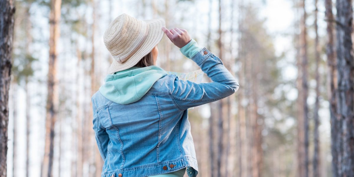 rear-view-woman-wearing-hat-head-looking-trees-forest rear-view-woman-wearing-hat-head-looking-trees-forest